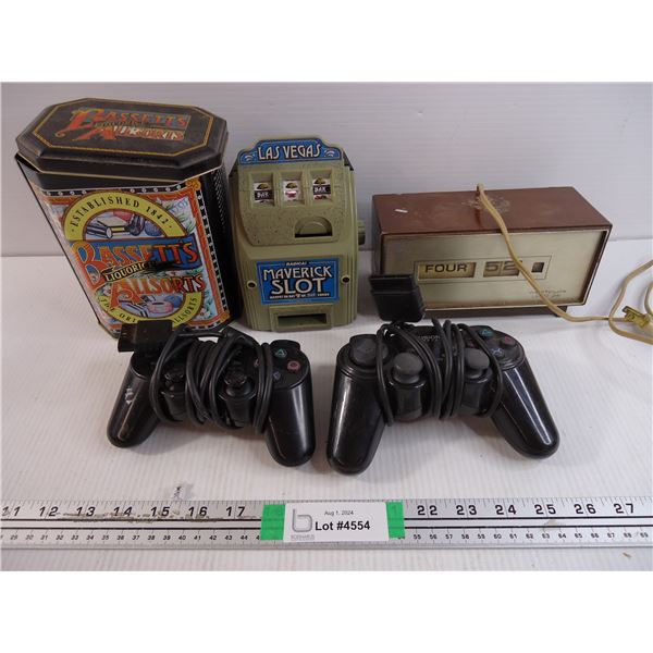 Clock (working),Tin, Plastic Slot Machine and (2) PS2 Controllers