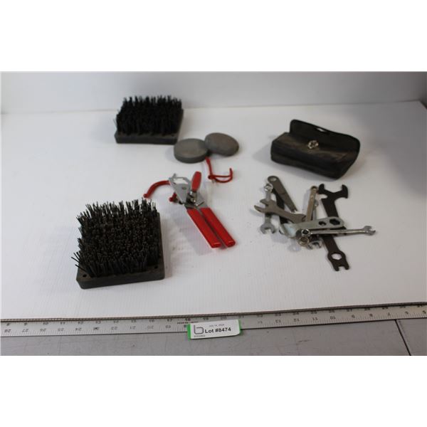 Wrench Set, Bood/Shoe Cleaners, Can Opener, Stones(???)