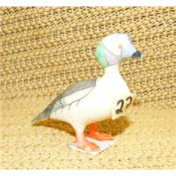 Old ivory bird with colored face and broken beak (170)