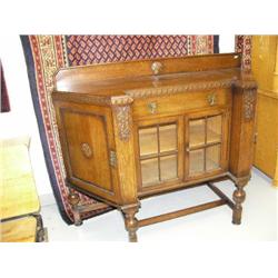 Art deco buffet, with doors on side, silver wear drawer and glass doors on front, 43" high, 54" leng