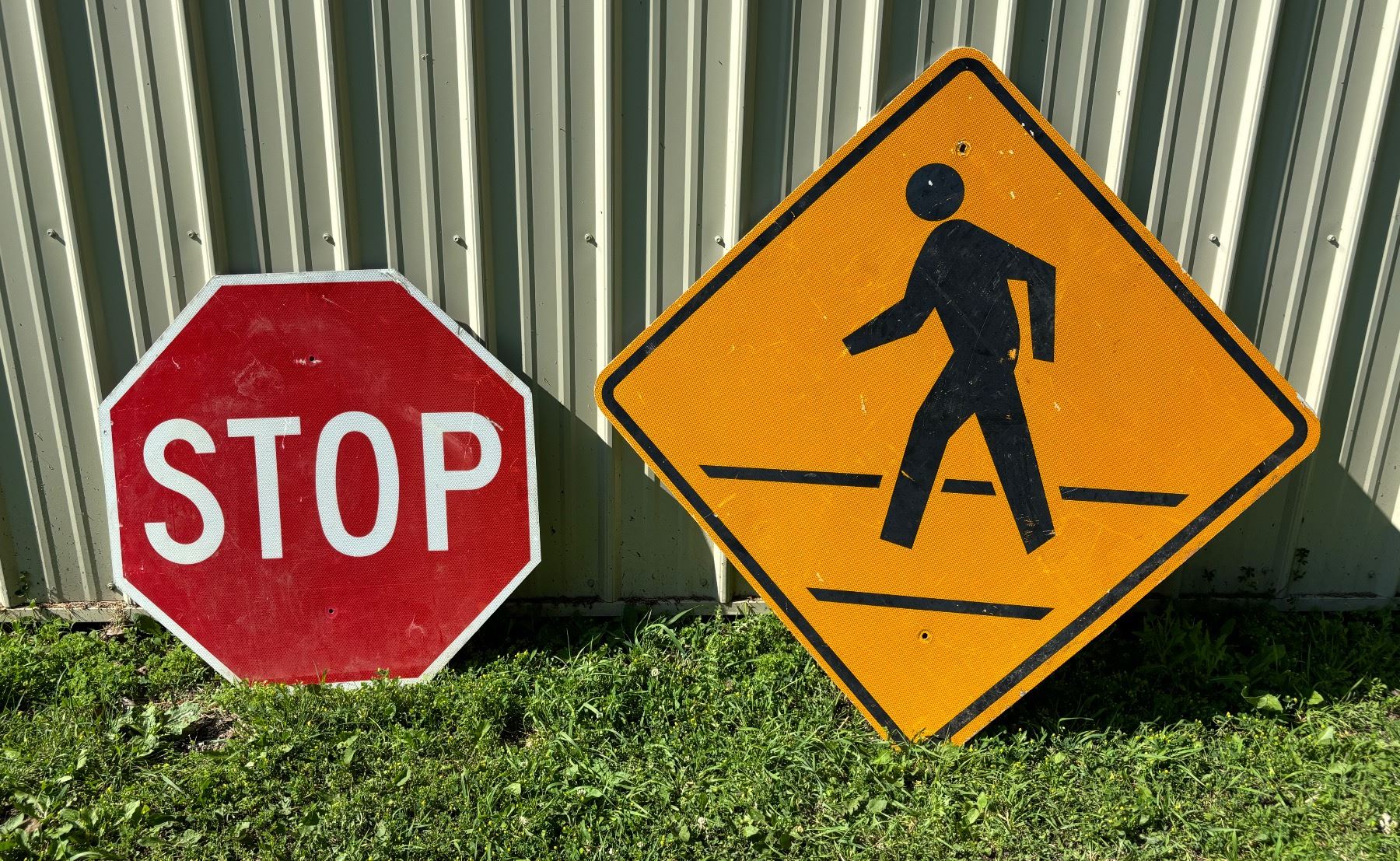 LARGE STOP AND LARGE PEDESTRIAN CROSSING STREET SIGNS