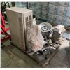 Image 1 : Pallet lot of Misc Including - Tire Rims, Vent Furnace, Pair of Shoes, Rotair Compressor Part, Cable