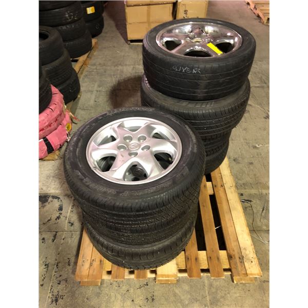 Pallet full of assorted rims w/ tires
