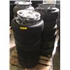 Image 1 : Pallet full of assorted tires with plastic Subaru rim covers