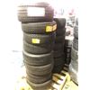 Image 1 : Pallet full of assorted new and used tires.