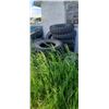 Image 1 : LARGE PILE OF ASSORTED TIRES  AND RIMS