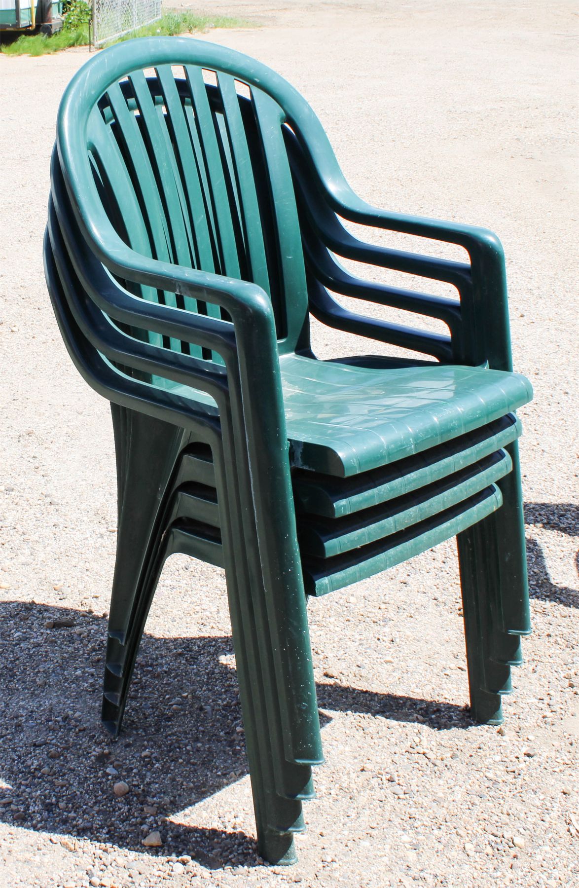 4 GREEN PLASTIC STACKABLE PATIO CHAIRS