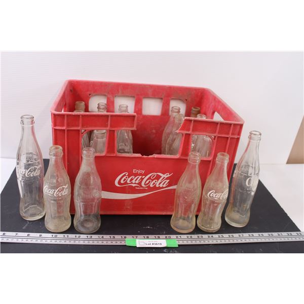 (25) Coca Cola Glass Bottles in Red Coca Cola Crate (Missing One Handle as Shown)