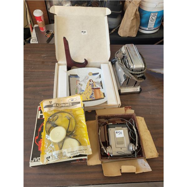 Old toaster, head phones, recorder, religious picture.