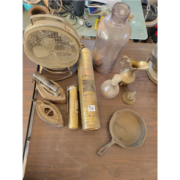 2 sad irons, fans, fire ext., purple vase, small bell, frying pan.