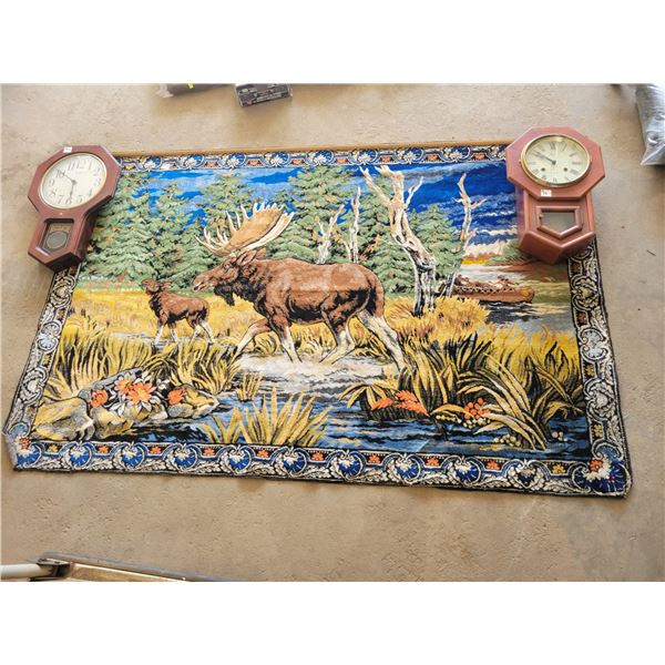 Moose rug and 2 hanging clocks.