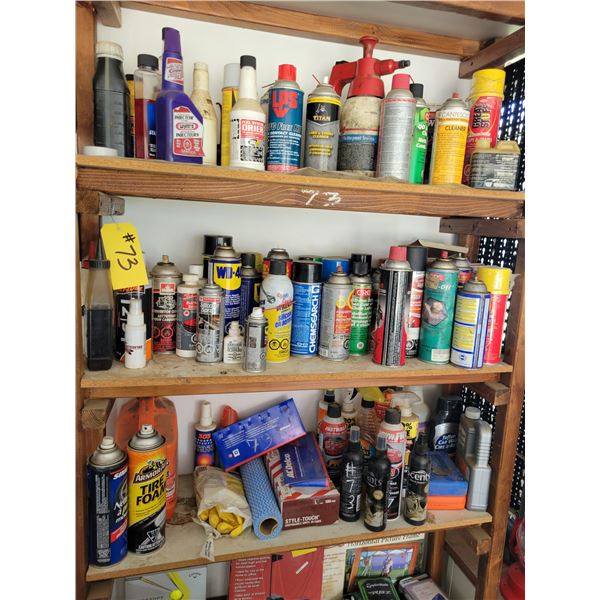 3 shelves of various sprays, and cleaning compounds.