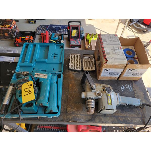 2 Makita battery operated drills,  2 boxes of vinyl tape, and performax side drill