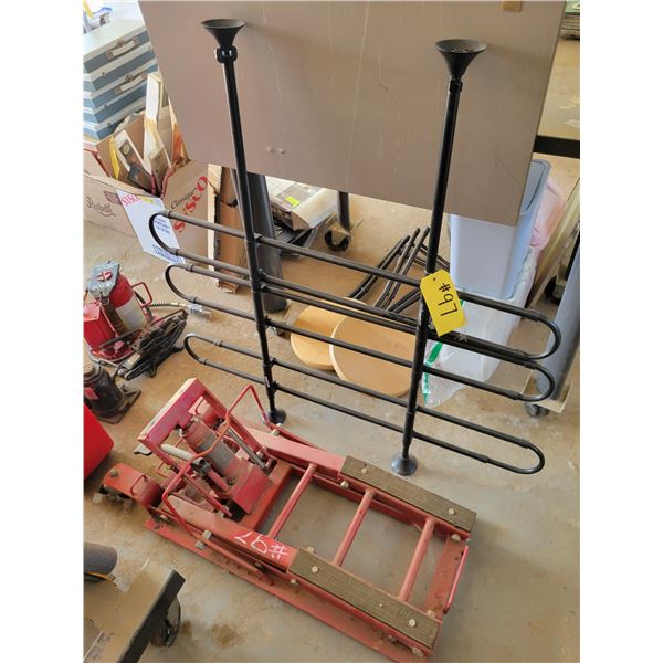 Black metal frame, and rolling motorcycle jack.