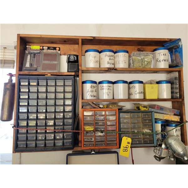 Assorted screws, bolts, elect, and misc. tools.  Wood shelf does not go.
