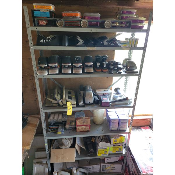Metal stand complete with collection of staplers, hole punches, deck screws, nails, level,  camp fue