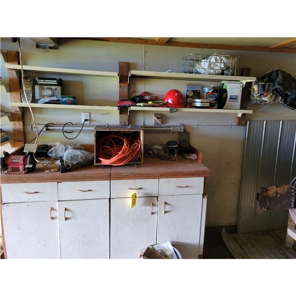 Bench c/w grinder, satellite radio, saw blades, power cords, fittings, pipes, hard hat etc.
