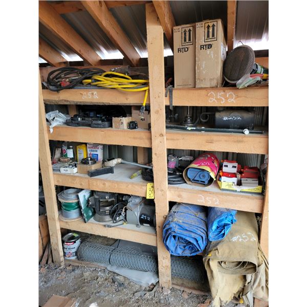 Tarps, cords, torches, bit sharpener, fuel pump & misc. on shelf, cable roof repair