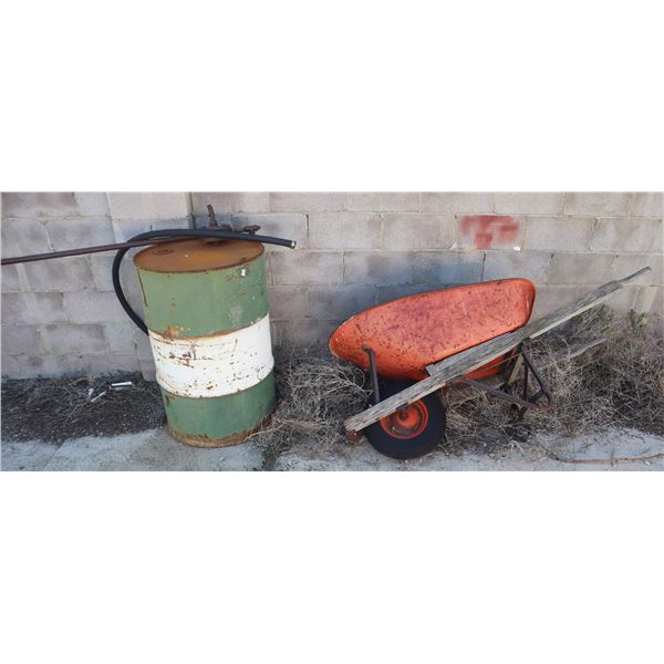 STEEL DRUM SOLD WITH WHEEL BARROW