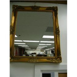 Ornately framed mirror (195)