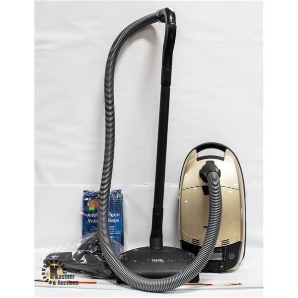 MIELE CANNISTER VACUUM WITH BAGS & ATTACHMENTS