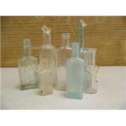 Lot of old patent medicine bottles with writing (194)