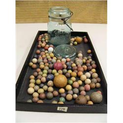 Large collection of clay marbles and green jar marked Wide Mouth Telephone Jar (194)