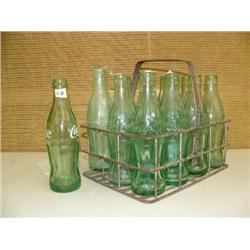 Lot of coke bottles with metal carrier (194)