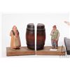 Image 2 : Two pieces of hand carved folksware including lady feeding chickens and pair of barrel bookends