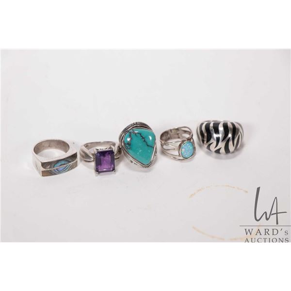Two sterling silver rings including round opal/ opal like size 5.5 and mother-of-pearl size 8, ameth