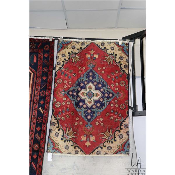 100% handmade Iranian wool carpet "Tabriz' with center medallion, red background and stylized floral