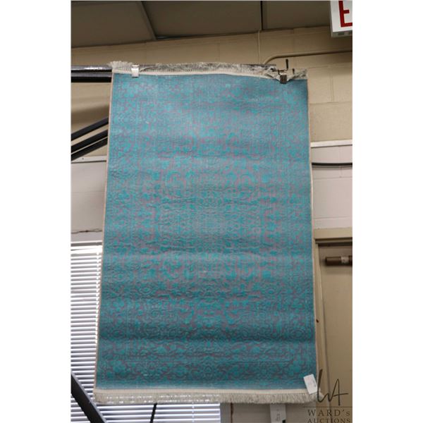 Premium Collection Sizan carpet poly/ cotton blend carpet with mauve background and aqua blue highli
