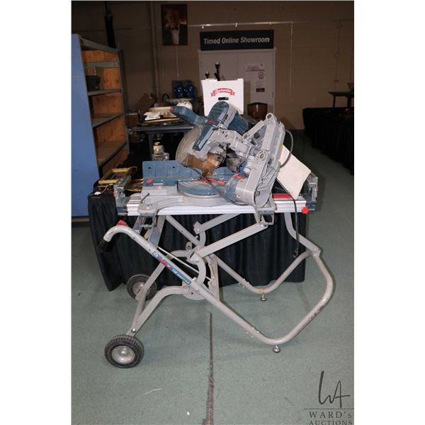 Bosch 12" compound miter saw CM10GD on Bosch TB4 gravity rise, folding stand, working at time of cat