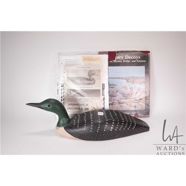 Vintage wooden duck decoy with 14" long base, 6" in height, artist initialed R.B. underneath and ass