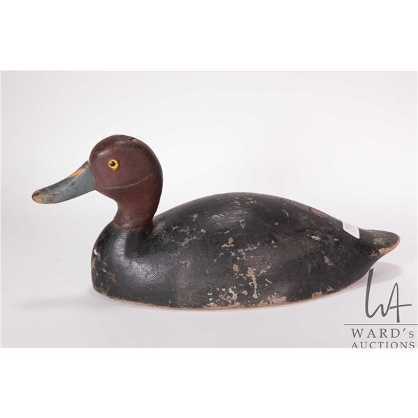 Vintage wooden duck decoy with 12 1/4" base, 6 1/2" height, marked "Wolark" and tagged "1664" undern