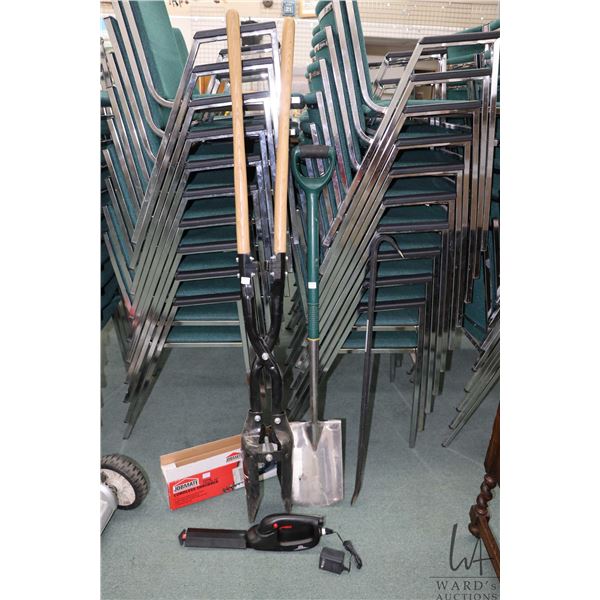 Manual post hole digger, a small nickel plated spade, 36" pry bar and Jobmate cordless shrubber hedg