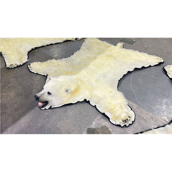 POLAR BEAR RUG WITH PAPERS APPROXIMATELY 83 INCHES FROM TAIL TO NOSE