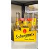 Image 2 : SHELF OF VINTAGE SCHWEPPES TONIC WATER BOTTLES WITH CARRIERS