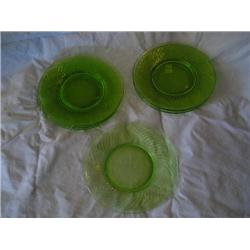 7 Vasaline glass swirl salad plates