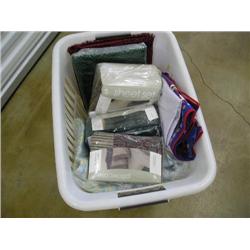Laundry basket filled w/linens
