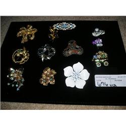 12 brooches