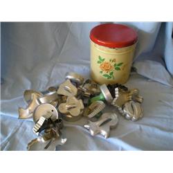 Old tin filled w/cookie cutters