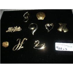 9 gold brooches