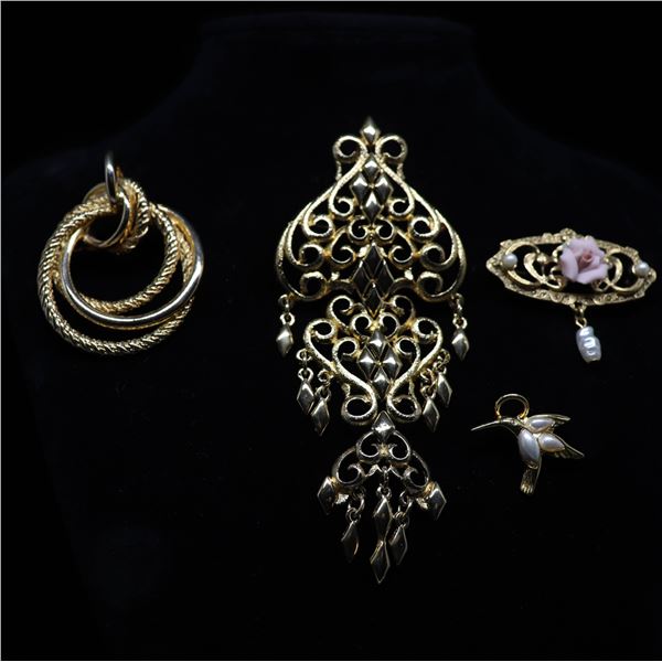 Three Brooches and one pin, gold tone