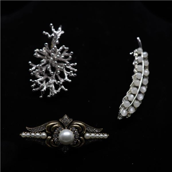 Three brooches