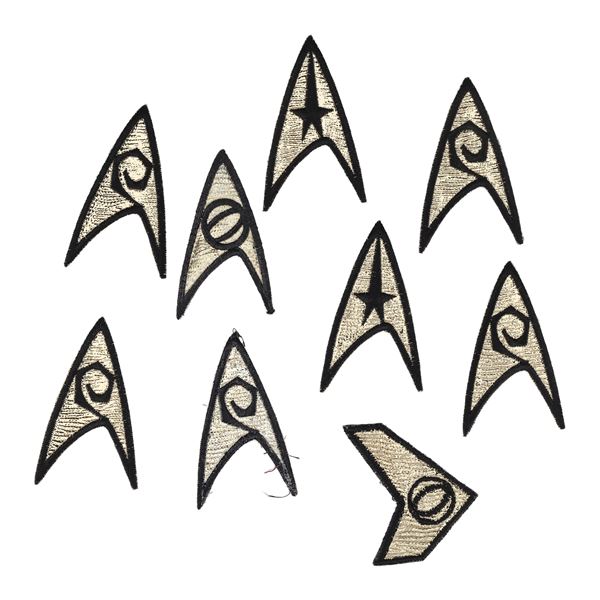 1521. Michael and Denise Okuda Collection: Set of Nine Enterprise and Defiant Badges ### STAR TREK: 