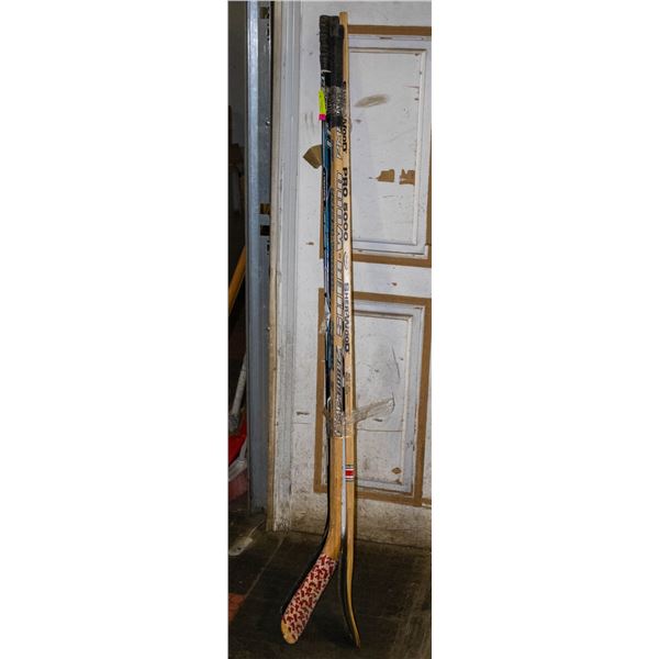 LOT OF 4 HOCKEY STICKS