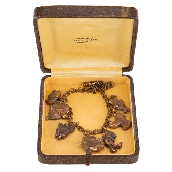 A Disney 7-Charm Bracelet and Case.