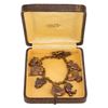 Image 1 : A Disney 7-Charm Bracelet and Case.
