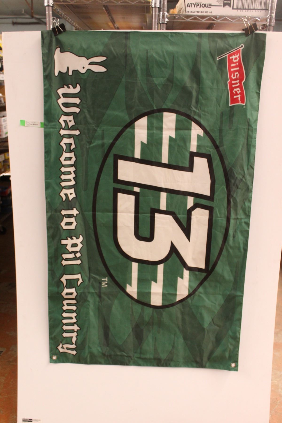 Pil Country Pilsner and Roughriders Flag 50'' - Bodnarus Auctioneering